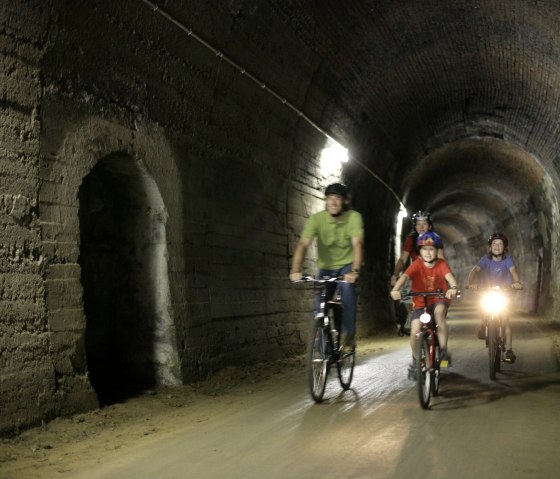 The tunnel passage near Bleialf makes it clear: the Eifel-Ardennes Cycle Route was originally a railroad line, &copy; Eifel Tourismus GmbH/intention