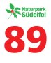 Logo of the Southern Eifel Nature Park with holly motif and large red number 89 underneath., © Naturpark Südeifel