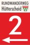 Wegwijzer voor de H&uuml;tterscheid rondwandeling met het nummer 2 en een pijl die naar links wijst op een rode achtergrond., &copy; VDM